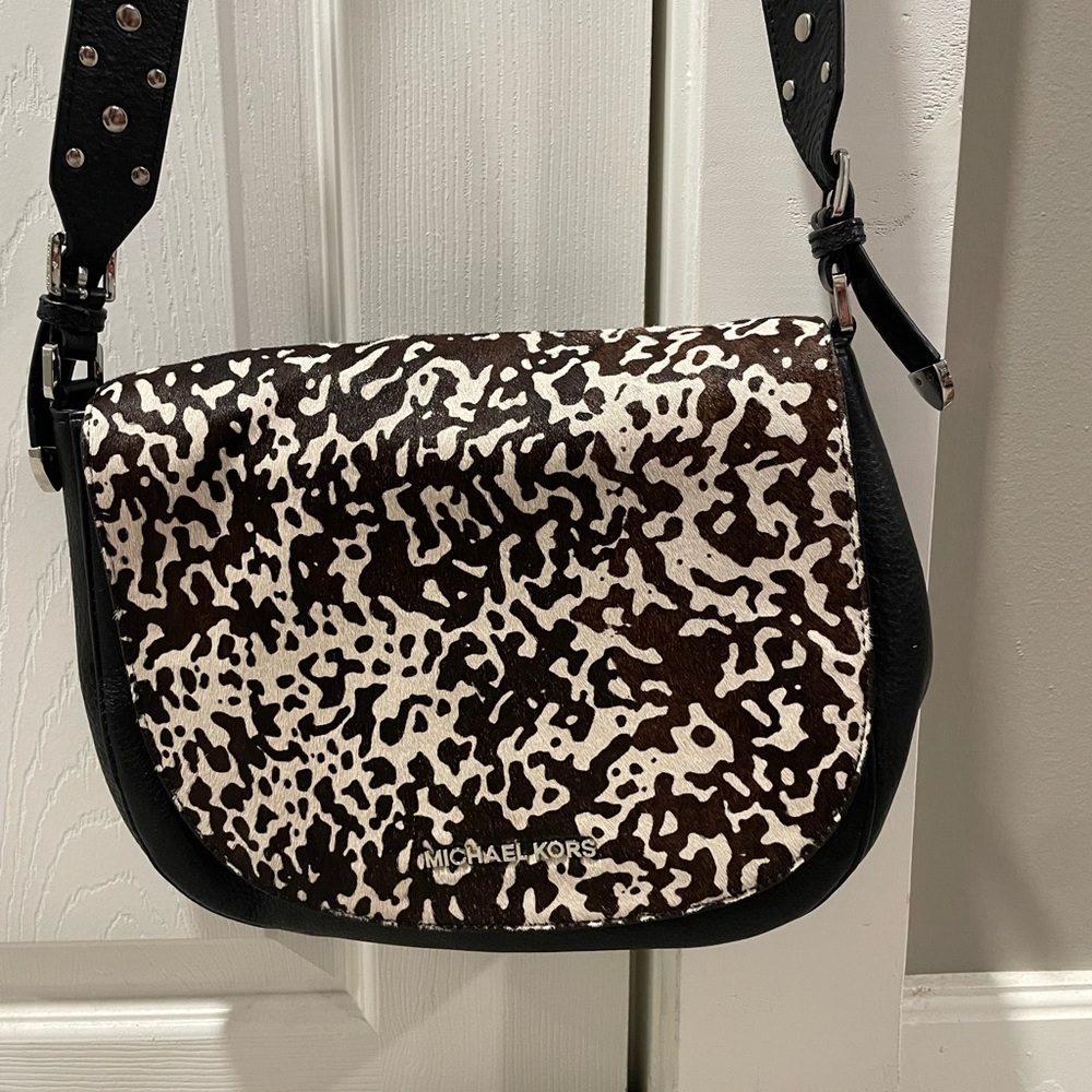 Leather and calf hair crossbody bag with studded strap